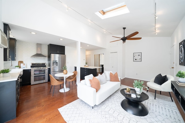 1604 74th St Unit D15, North Bergen, NJ 07047 - living room with rail lighting, a skylight, dark wood-type flooring, and a ceiling fan