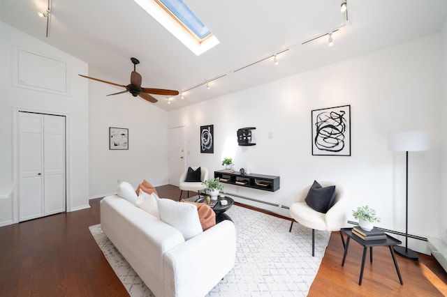 1604 74th St Unit D15, North Bergen, NJ 07047 - living room featuring rail lighting, wood finished floors, a skylight, ceiling fan, and vaulted ceiling