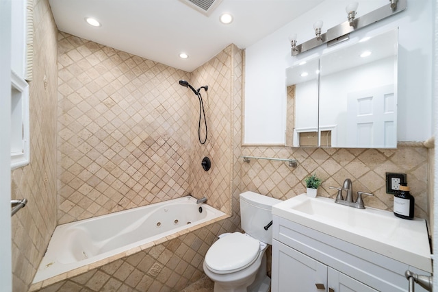 1604 74th St Unit D15, North Bergen, NJ 07047 - full bath with tile walls, a combined bath / shower with jetted tub, vanity, and recessed lighting