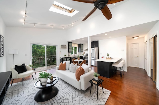 1604 74th St Unit D15, North Bergen, NJ 07047 - living room with track lighting, dark wood-style floors, a wall mounted air conditioner, a skylight, and a ceiling fan