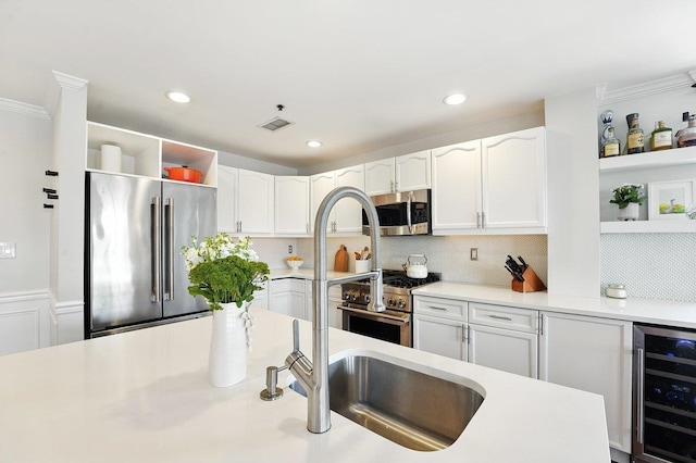 812 Grand St Unit 510, Hoboken, NJ 07030 - kitchen featuring open shelves, high quality appliances, beverage cooler, white cabinetry, and ornamental molding