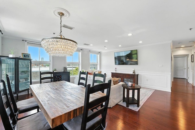 812 Grand St Unit 510, Hoboken, NJ 07030 - dining room with crown molding, a chandelier, dark wood finished floors, wainscoting, and recessed lighting