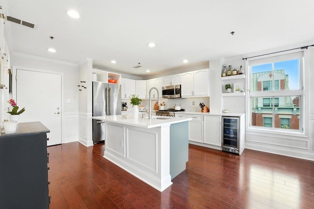 812 Grand St Unit 510, Hoboken, NJ 07030 - kitchen featuring stainless steel appliances, beverage cooler, open shelves, crown molding, and dark wood finished floors