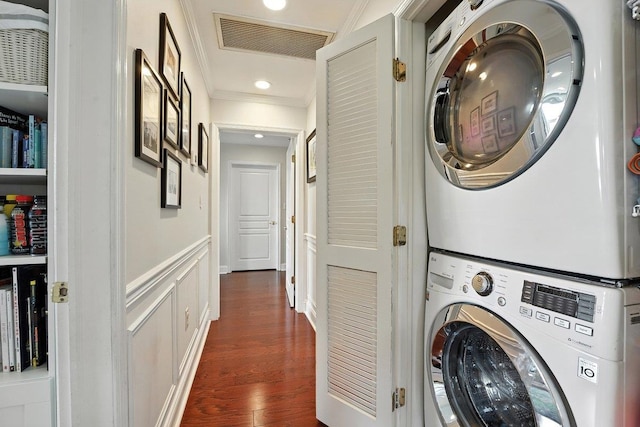 812 Grand St Unit 510, Hoboken, NJ 07030 - laundry room featuring stacked washer / drying machine, crown molding, dark wood finished floors, and recessed lighting