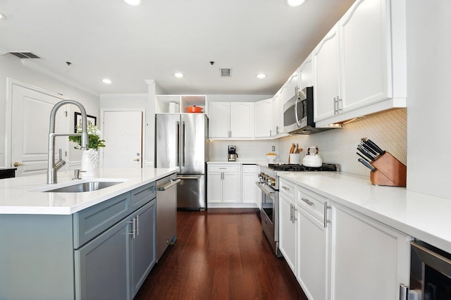 812 Grand St Unit 510, Hoboken, NJ 07030 - kitchen with appliances with stainless steel finishes, white cabinets, crown molding, beverage cooler, and decorative backsplash