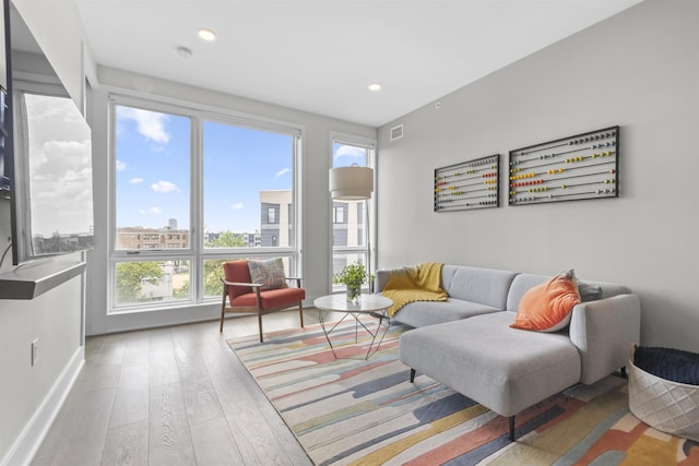 380 Newark Ave Unit 504, Jersey City, NJ 07302 - living room featuring wood finished floors and recessed lighting