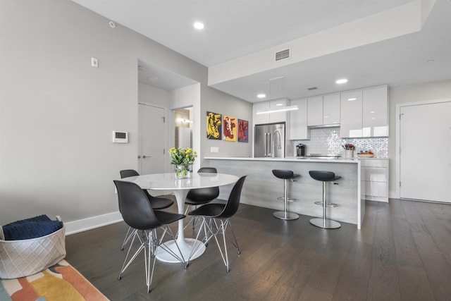380 Newark Ave Unit 504, Jersey City, NJ 07302 - dining area featuring dark wood-type flooring and recessed lighting