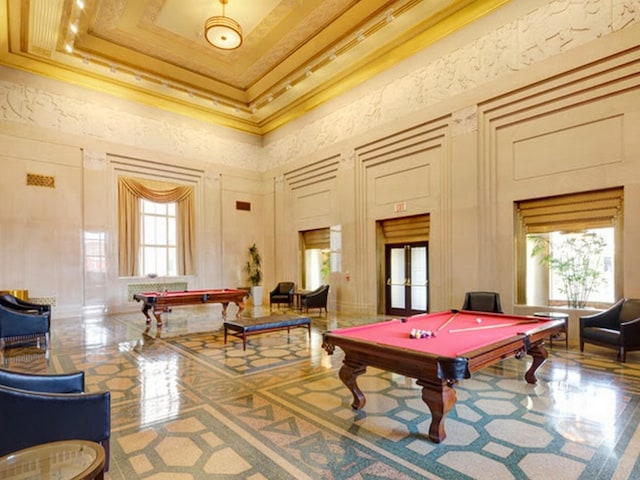 playroom featuring pool table, crown molding, a high ceiling, and a wealth of natural light