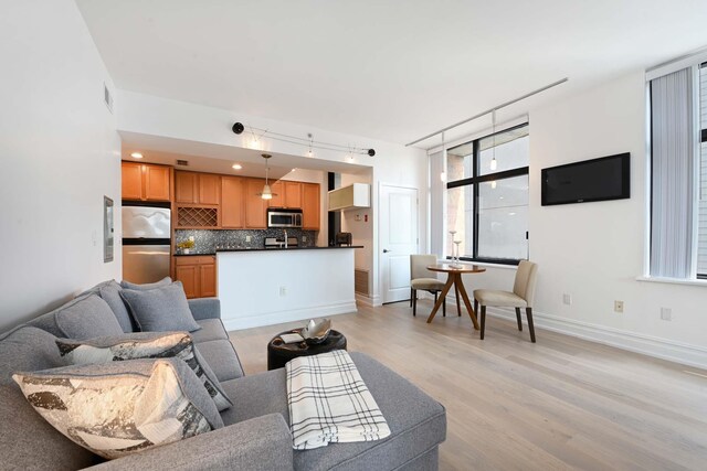 610 Newark St Unit 4A, Hoboken, NJ 07030 - living room with light wood finished floors and baseboards