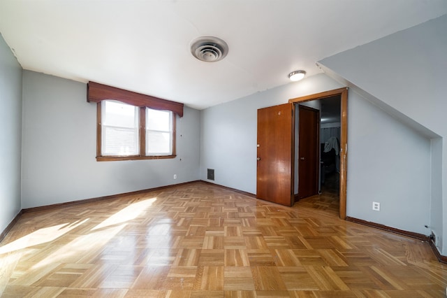 additional living space with light parquet flooring