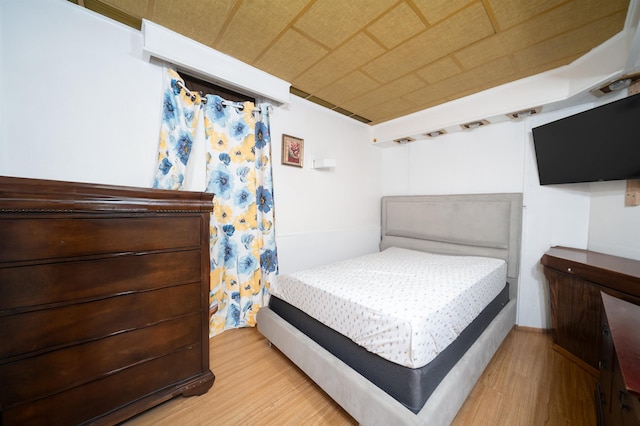 bedroom with light hardwood / wood-style floors