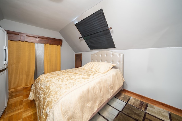 bedroom featuring vaulted ceiling