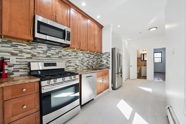 138 Leonard St Unit 2R, Jersey City, NJ 07307 - kitchen featuring stainless steel appliances, a baseboard radiator, brown cabinetry, tasteful backsplash, and recessed lighting
