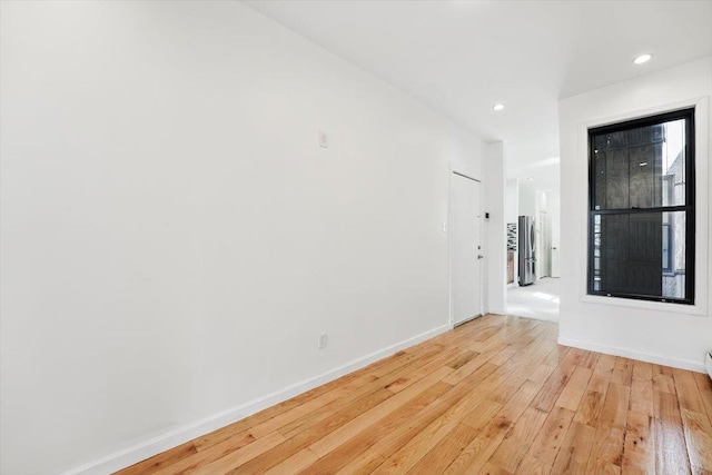 138 Leonard St Unit 2R, Jersey City, NJ 07307 - unfurnished room featuring light wood-style flooring, baseboards, and recessed lighting