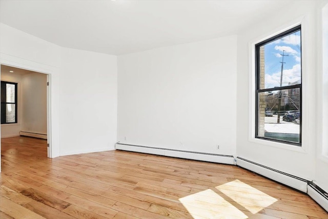 138 Leonard St Unit 2R, Jersey City, NJ 07307 - spare room with a baseboard radiator and light wood finished floors