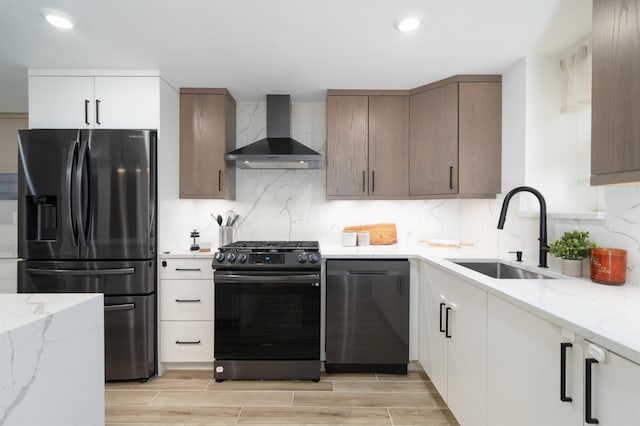 201 Zabriskie St Unit 1, Jersey City, NJ 07307 - kitchen featuring wall chimney exhaust hood, fridge with ice dispenser, gas range, dishwasher, and light stone counters