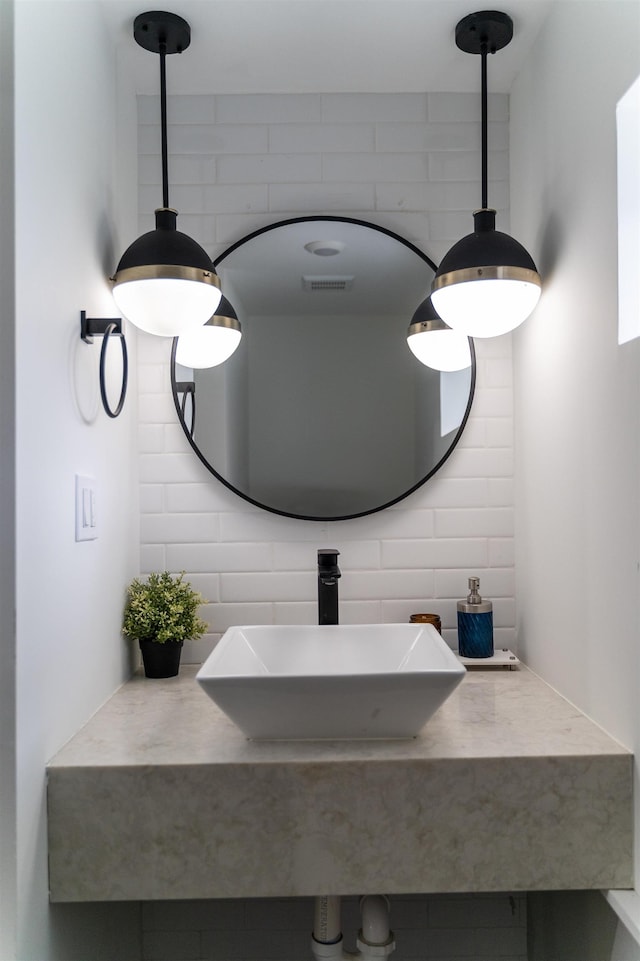 201 Zabriskie St Unit 1, Jersey City, NJ 07307 - bathroom featuring a sink and backsplash