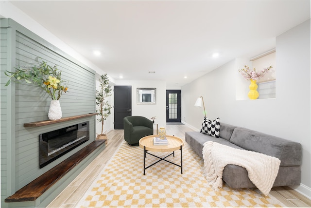 201 Zabriskie St Unit 1, Jersey City, NJ 07307 - living area featuring light wood-style flooring, recessed lighting, and a glass covered fireplace