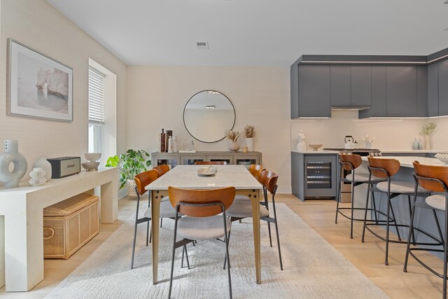 kitchen featuring a center island, a wealth of natural light, and light hardwood / wood-style flooring