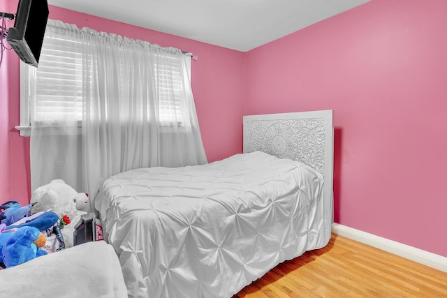 555 61st St, West New York, NJ 07093 - bedroom featuring wood finished floors and baseboards