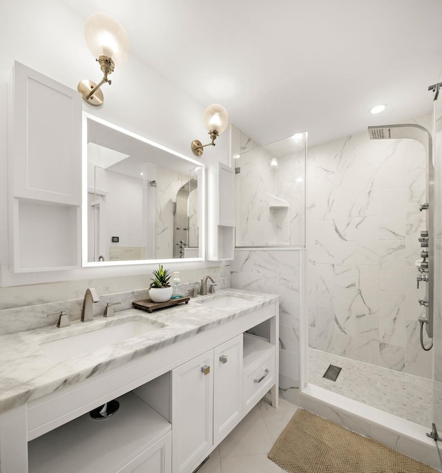 bathroom featuring tile walls, a tile shower, and vanity