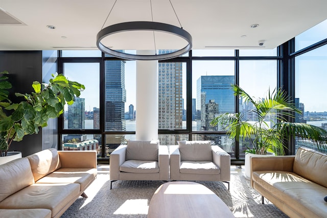 10 Provost St Unit 416, Jersey City, NJ 07302 - living room with a skyline view and a wall of windows