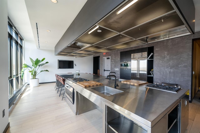 10 Provost St Unit 416, Jersey City, NJ 07302 - kitchen with stainless steel counters, appliances with stainless steel finishes, modern cabinets, open shelves, and wine cooler