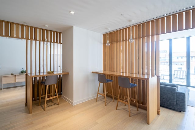 10 Provost St Unit 416, Jersey City, NJ 07302 - dining space with wood finished floors, plenty of natural light, recessed lighting, and a bar