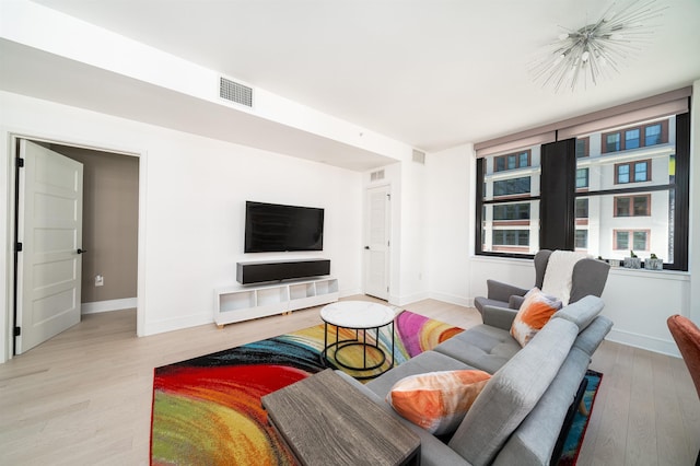 10 Provost St Unit 416, Jersey City, NJ 07302 - living area featuring light wood-style flooring and baseboards