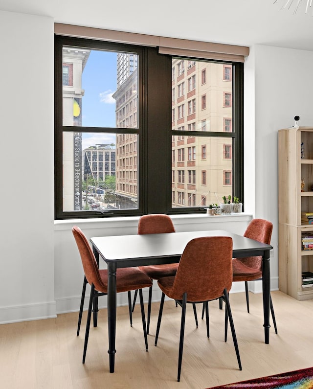 10 Provost St Unit 416, Jersey City, NJ 07302 - dining space featuring baseboards and wood finished floors