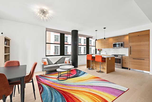 10 Provost St Unit 416, Jersey City, NJ 07302 - living room featuring light wood-style floors and baseboards