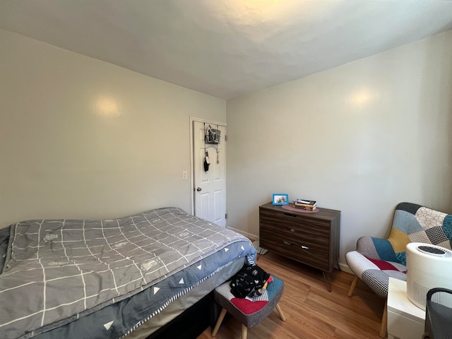 bedroom with hardwood / wood-style flooring