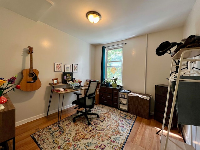 home office with light wood-type flooring