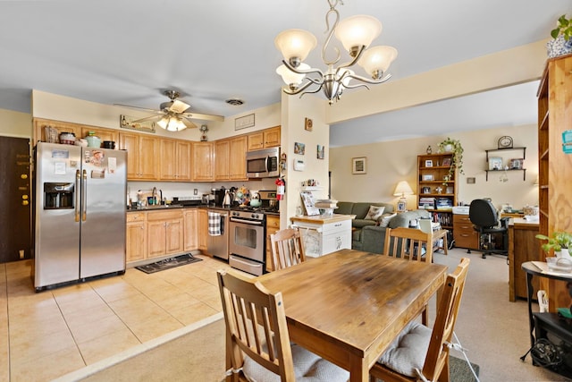 dining room with visible vents, light tile patterned floors, ceiling fan with notable chandelier, and light colored carpet