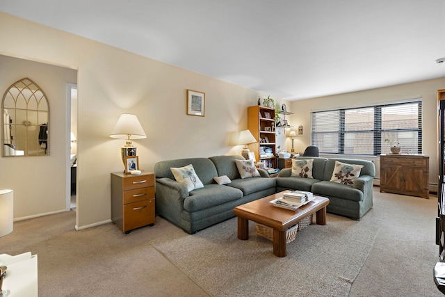 living room featuring light colored carpet and baseboards