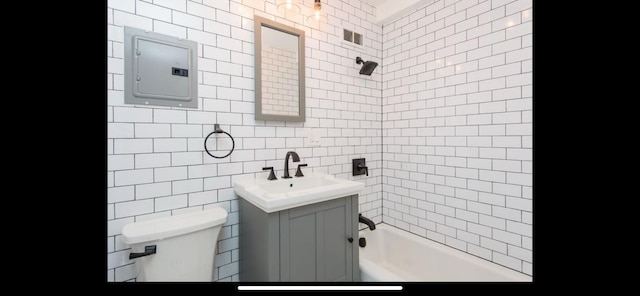 bathroom featuring vanity, visible vents, shower / bathtub combination, toilet, and electric panel