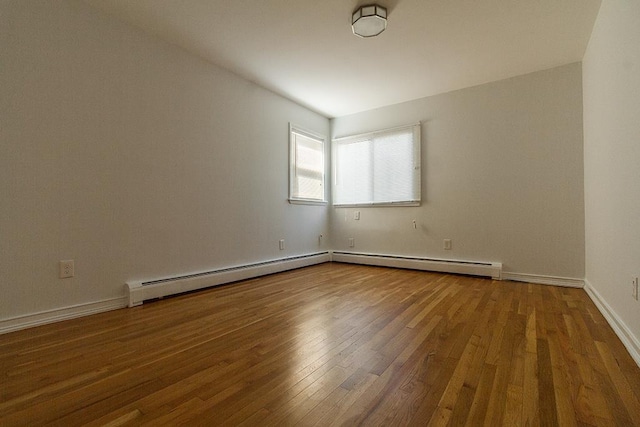226 57th St, West New York, NJ 07093 - unfurnished room featuring baseboard heating and wood finished floors