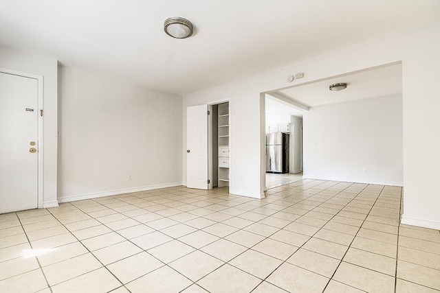 226 57th St, West New York, NJ 07093 - unfurnished room featuring baseboards and light tile patterned floors