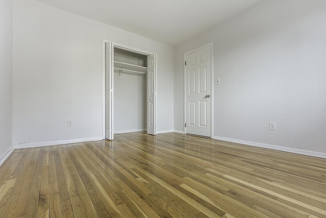 226 57th St, West New York, NJ 07093 - unfurnished bedroom with wood finished floors and a closet