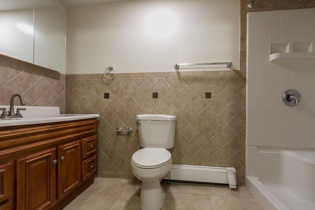 226 57th St, West New York, NJ 07093 - bathroom featuring a baseboard heating unit, a shower, tile walls, vanity, and tile patterned floors
