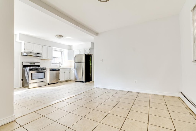 226 57th St, West New York, NJ 07093 - kitchen with appliances with stainless steel finishes, under cabinet range hood, light tile patterned floors, and a baseboard radiator