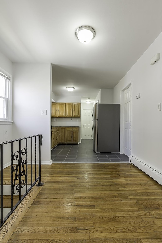 226 57th St, West New York, NJ 07093 - kitchen featuring freestanding refrigerator, brown cabinetry, and dark wood-style floors