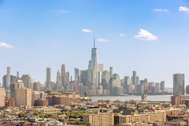 property's view of city featuring a water view