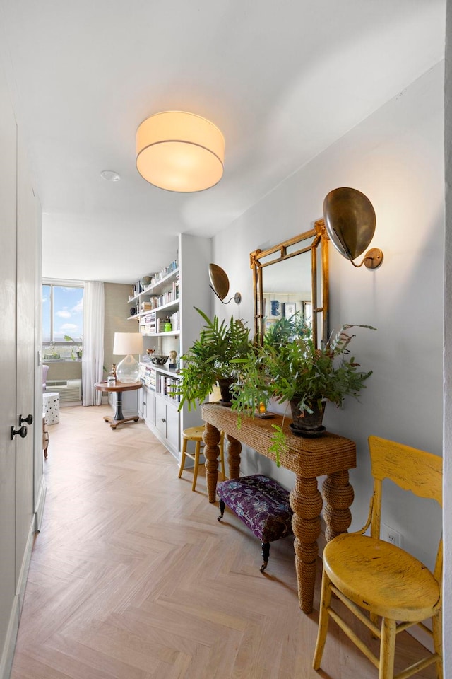 hallway featuring light parquet flooring