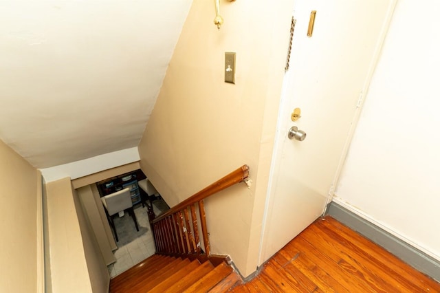 704 90th St, North Bergen, NJ 07047 - staircase featuring wood finished floors