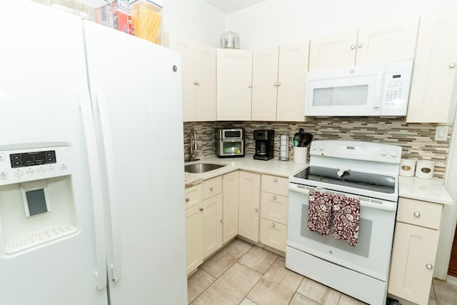 704 90th St, North Bergen, NJ 07047 - kitchen featuring white appliances, a sink, light countertops, and decorative backsplash