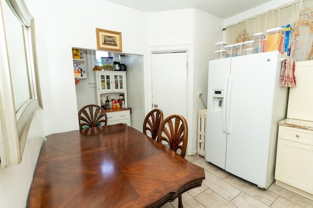 704 90th St, North Bergen, NJ 07047 - dining space featuring radiator