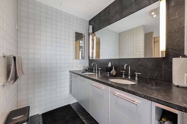 225 River St Unit 1901, Hoboken, NJ 07030 - bathroom with tile walls, double vanity, backsplash, and tile patterned flooring