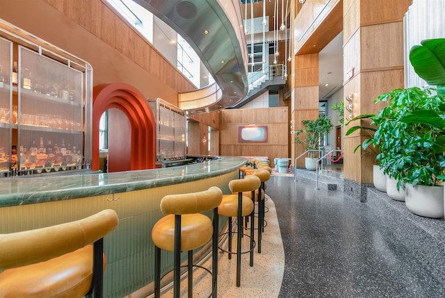 225 River St Unit 1901, Hoboken, NJ 07030 - community bar area featuring speckle patterned floor and a towering ceiling