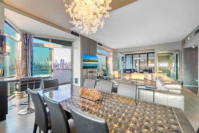 225 River St Unit 1901, Hoboken, NJ 07030 - dining area featuring a chandelier and wood finished floors